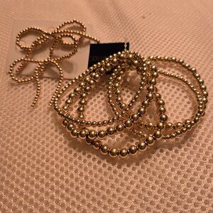 5 strand gold bead bracelet with gold beaded bow earrings